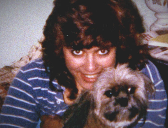 young Angelina Rodriguez with dog.